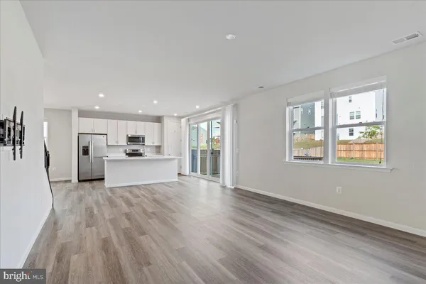 a view of entryway with wooden floor
