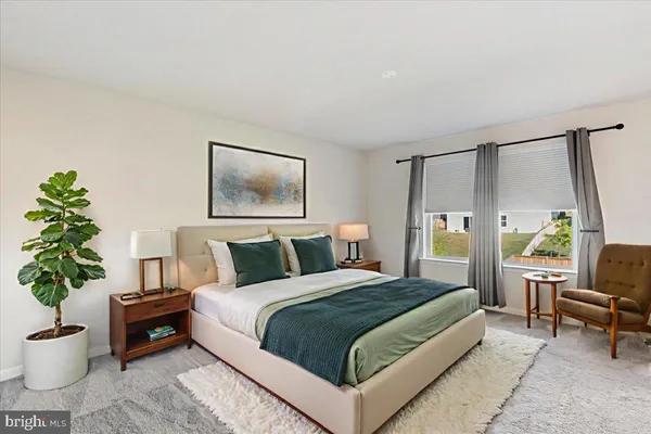 an empty room with closet and a bathroom