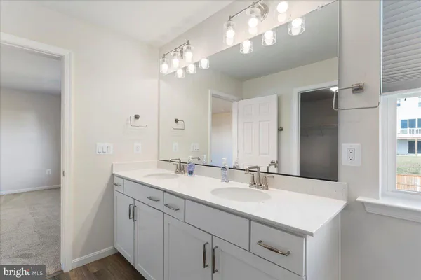 a bathroom with a shower and a sink