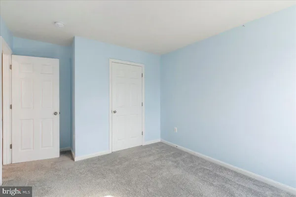a bathroom with a sink double vanity granite and a mirror