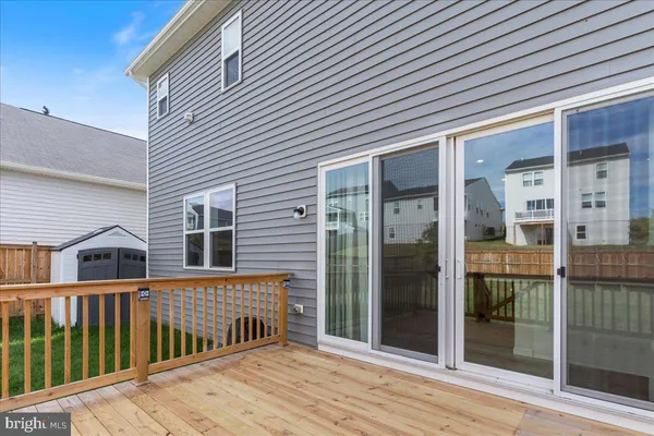 a view of a house with backyard and porch