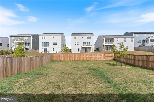 a house view with a backyard space