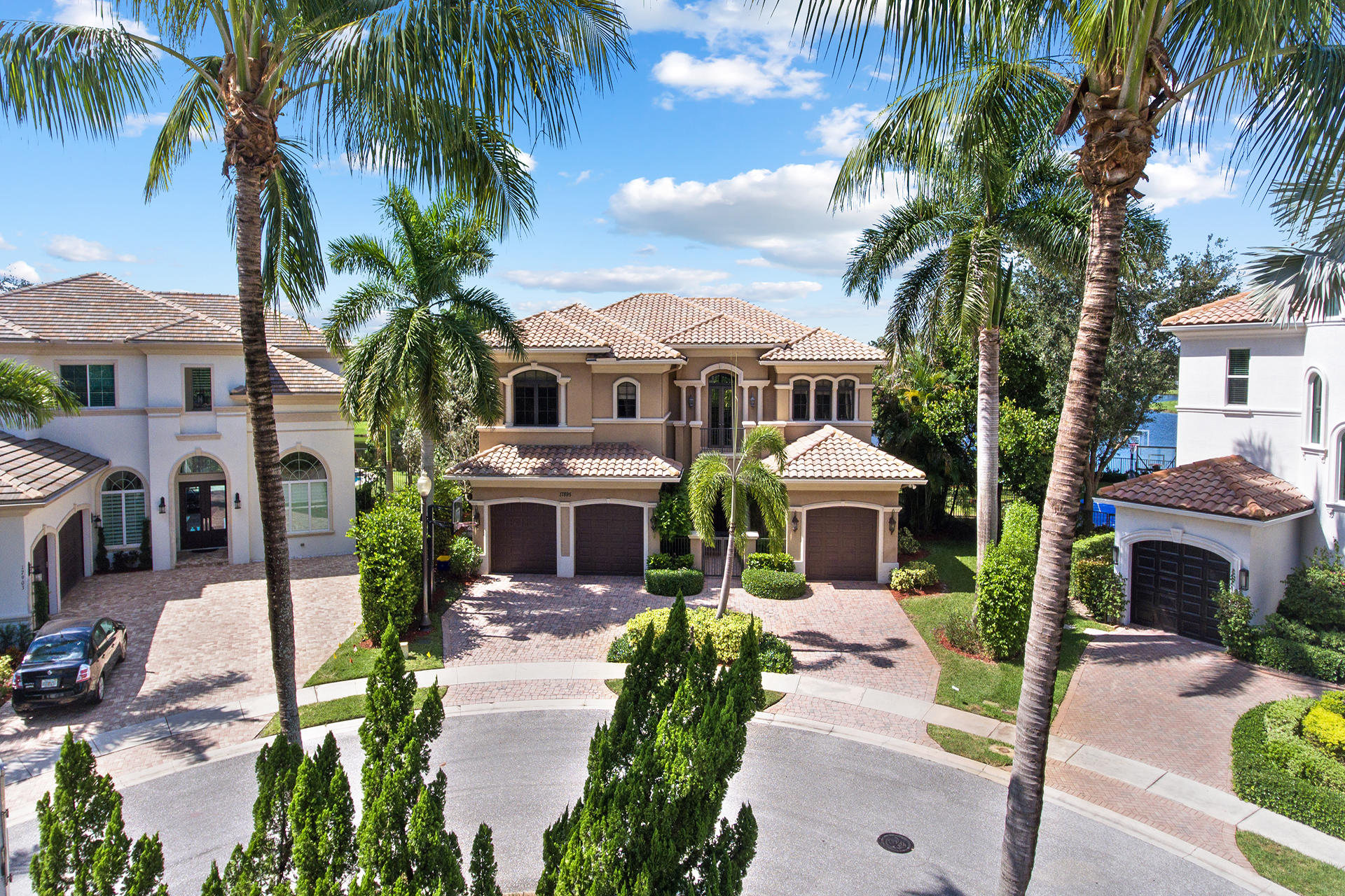 17895 Cadena Drive Boca Raton, FL 33496 - Photo 1 of 64 a front view of a house with a garden