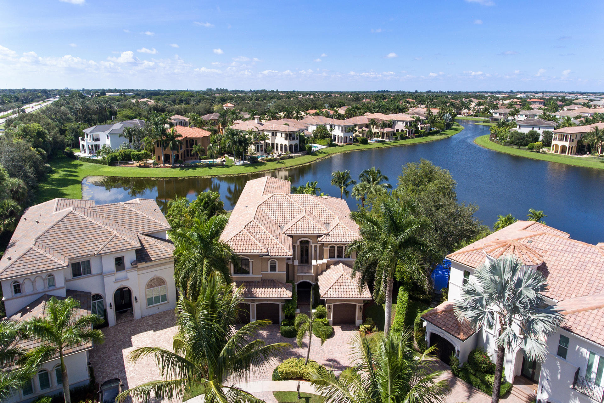 17895 Cadena Drive Boca Raton, FL 33496 - Photo 2 of 64 an aerial view of residential houses with outdoor space and lake view