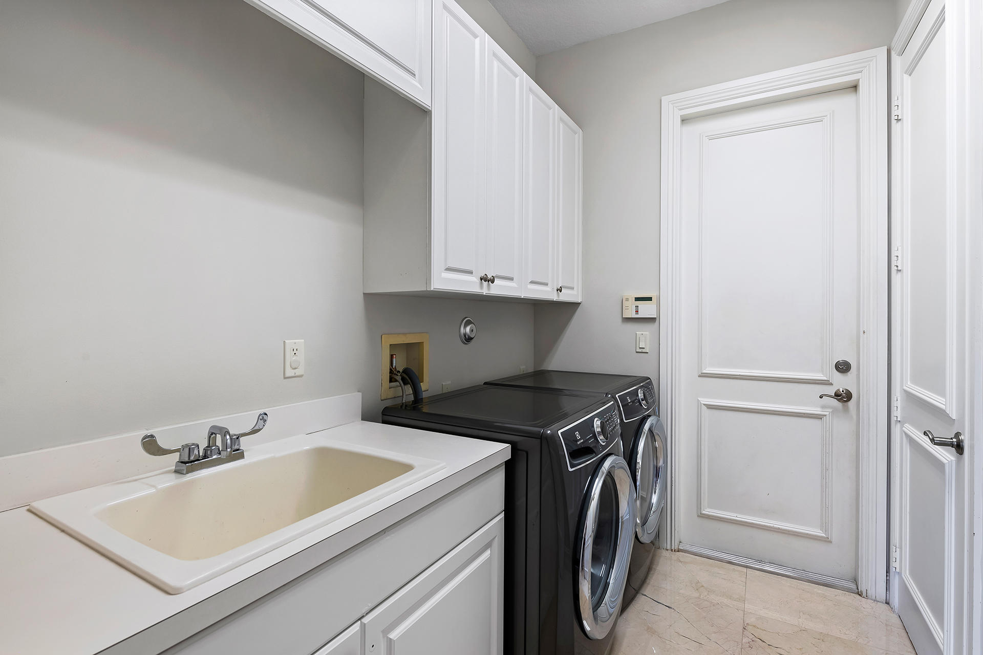 17895 Cadena Drive Boca Raton, FL 33496 - Photo 58 of 64 a utility room with sink dryer and washer