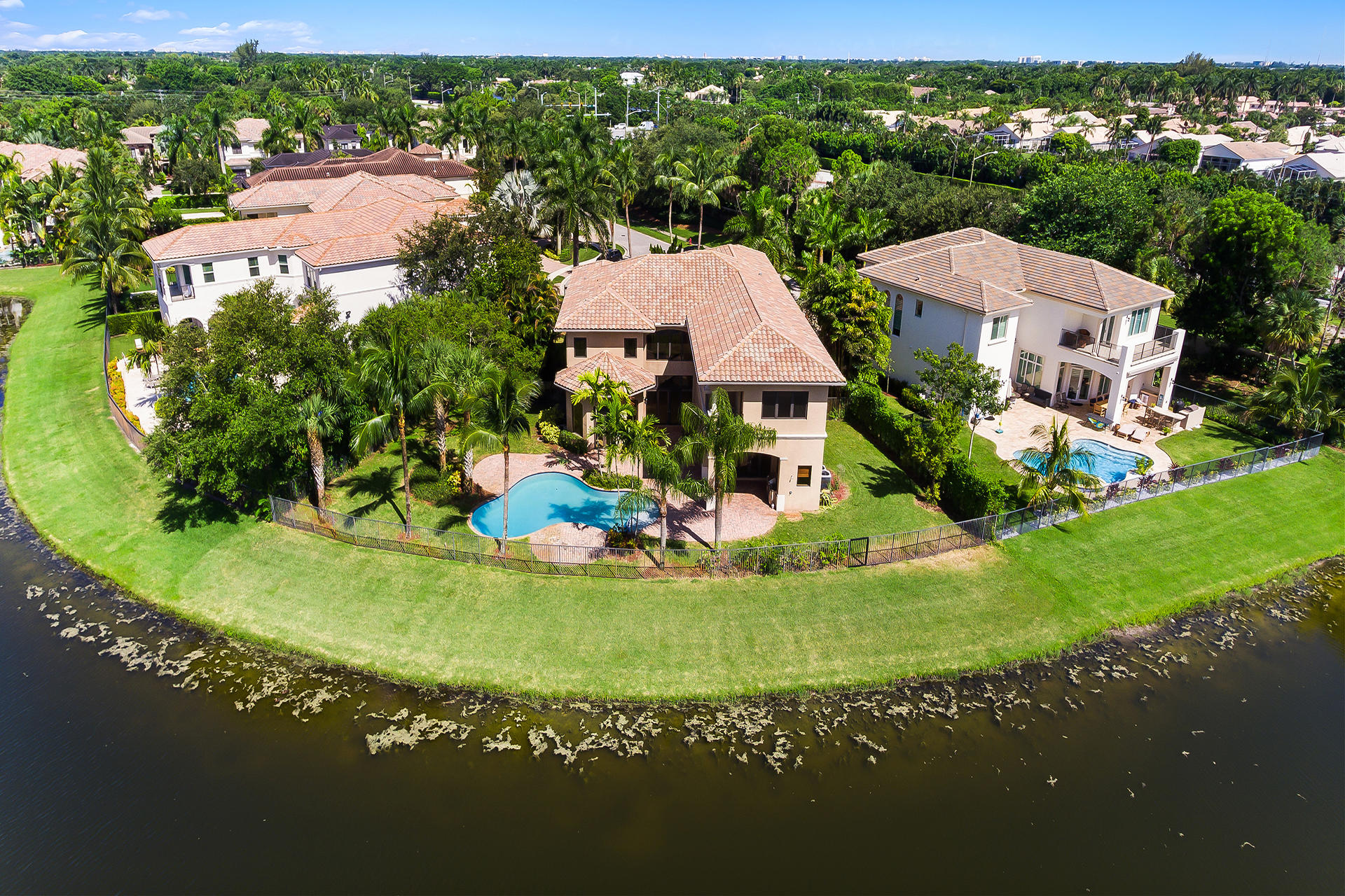 17895 Cadena Drive Boca Raton, FL 33496 - Photo 64 of 64 an aerial view of a house with a garden and lake view