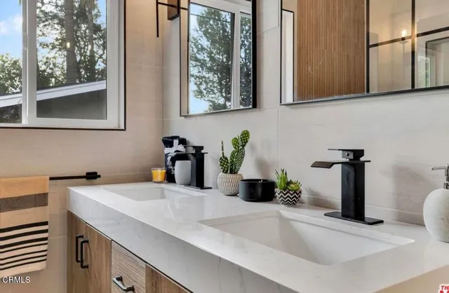 a kitchen with a sink and a window