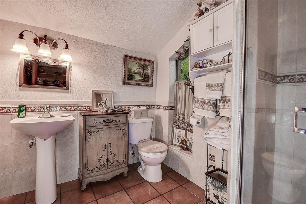 7323 Ray Browning Road Brooksville, FL 34601 - Photo 17 of 46 a bathroom with a sink toilet and shower