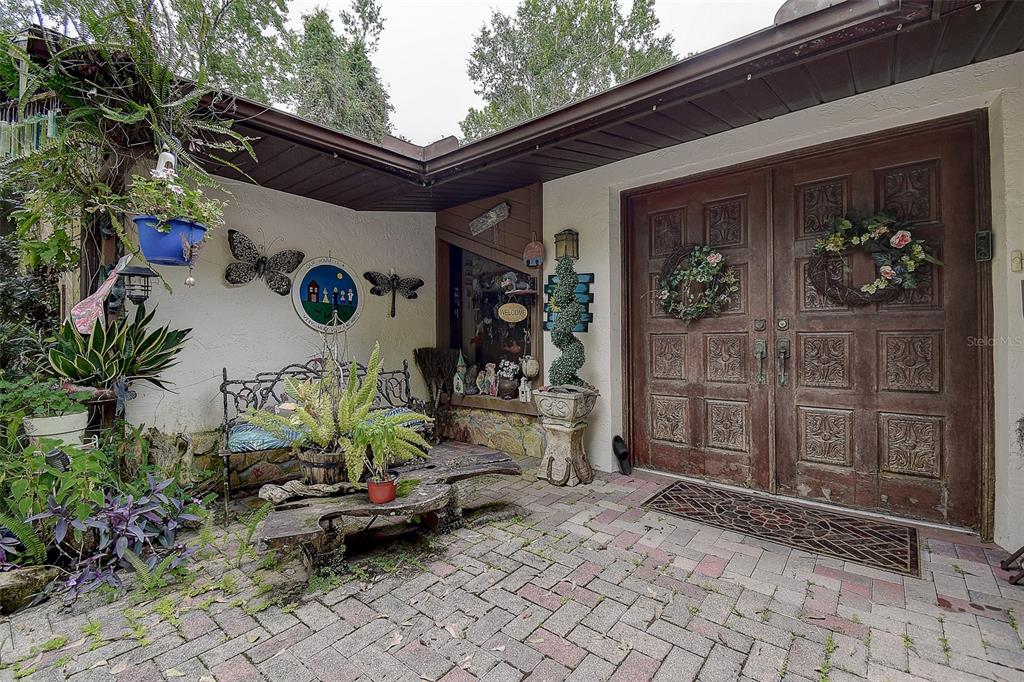 7323 Ray Browning Road Brooksville, FL 34601 - Photo 27 of 46 a backyard of a house with outdoor seating