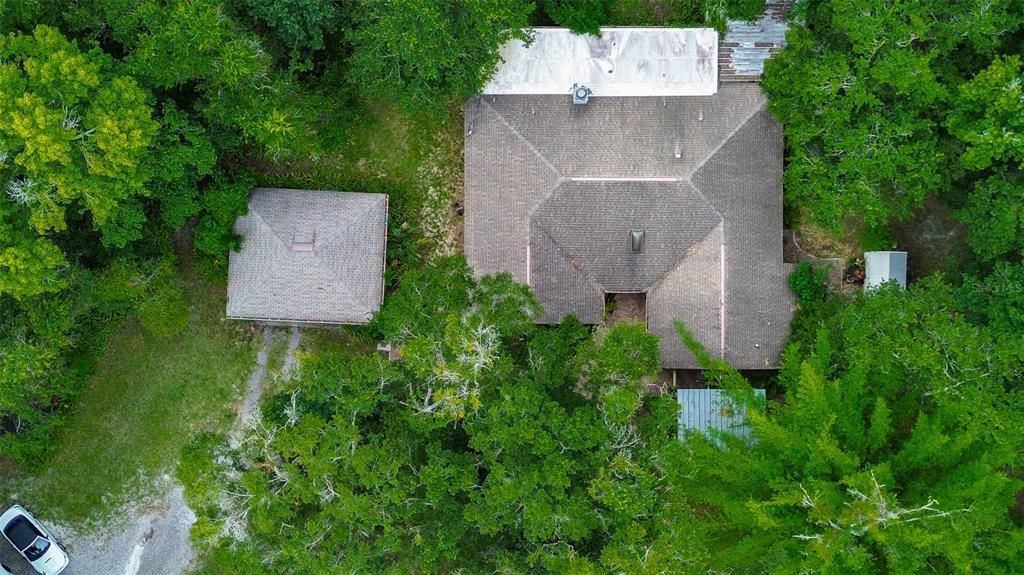 7323 Ray Browning Road Brooksville, FL 34601 - Photo 37 of 46 an aerial view of a house with a yard and trees all around