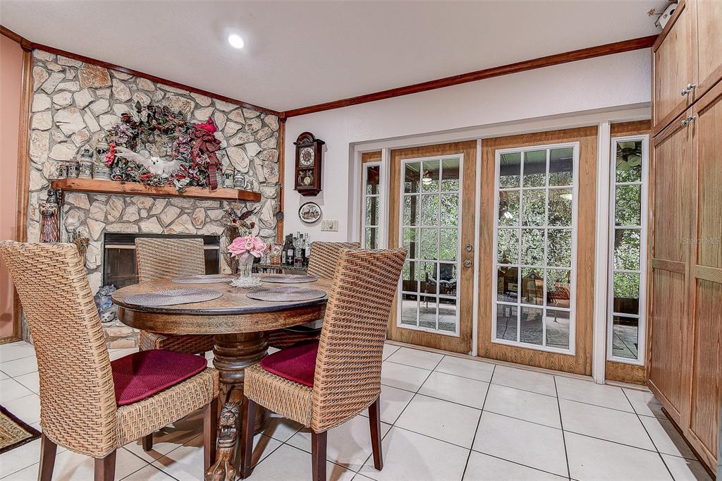 7323 Ray Browning Road Brooksville, FL 34601 - Photo 8 of 46 a view of a dining room with furniture window and outside view