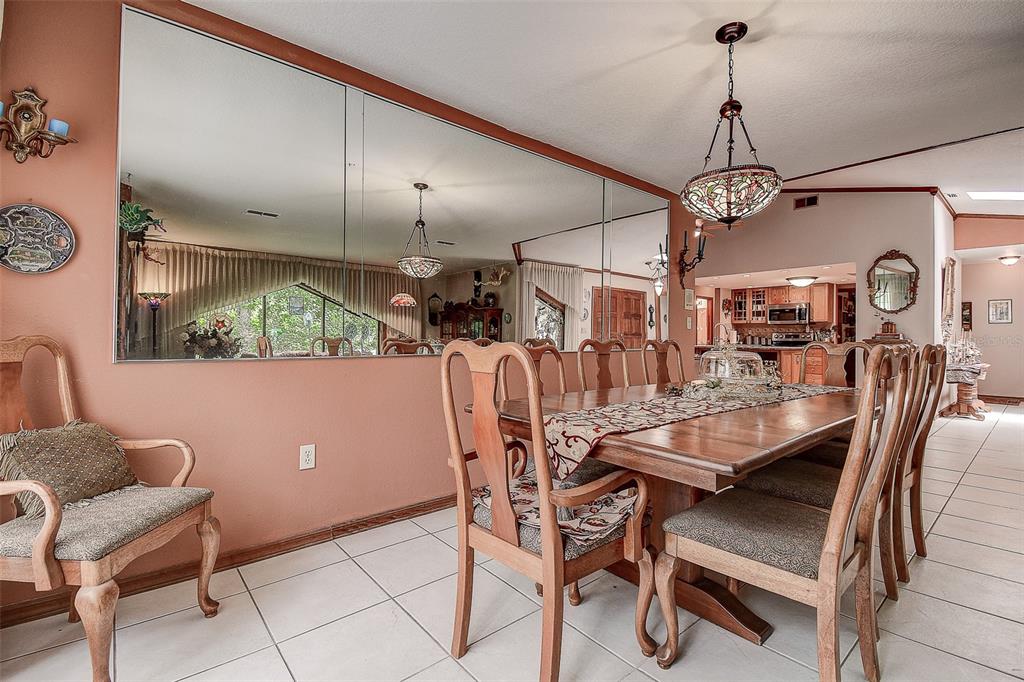 7323 Ray Browning Road Brooksville, FL 34601 - Photo 10 of 46 a view of a dining room with furniture window and wooden floor