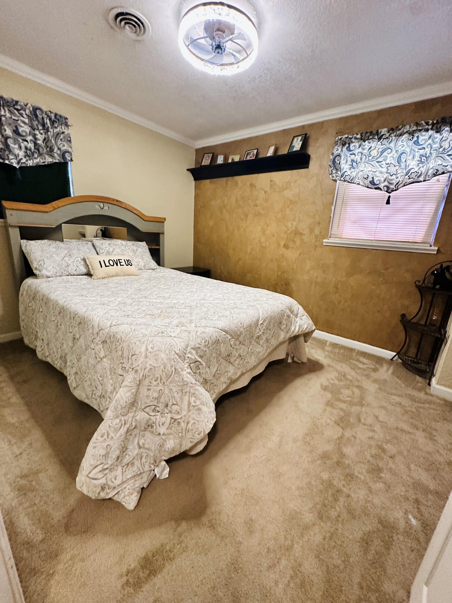 403 Osage Avenue Post, TX 79356 - Photo 25 of 31 a bedroom with a bed and a wall painting