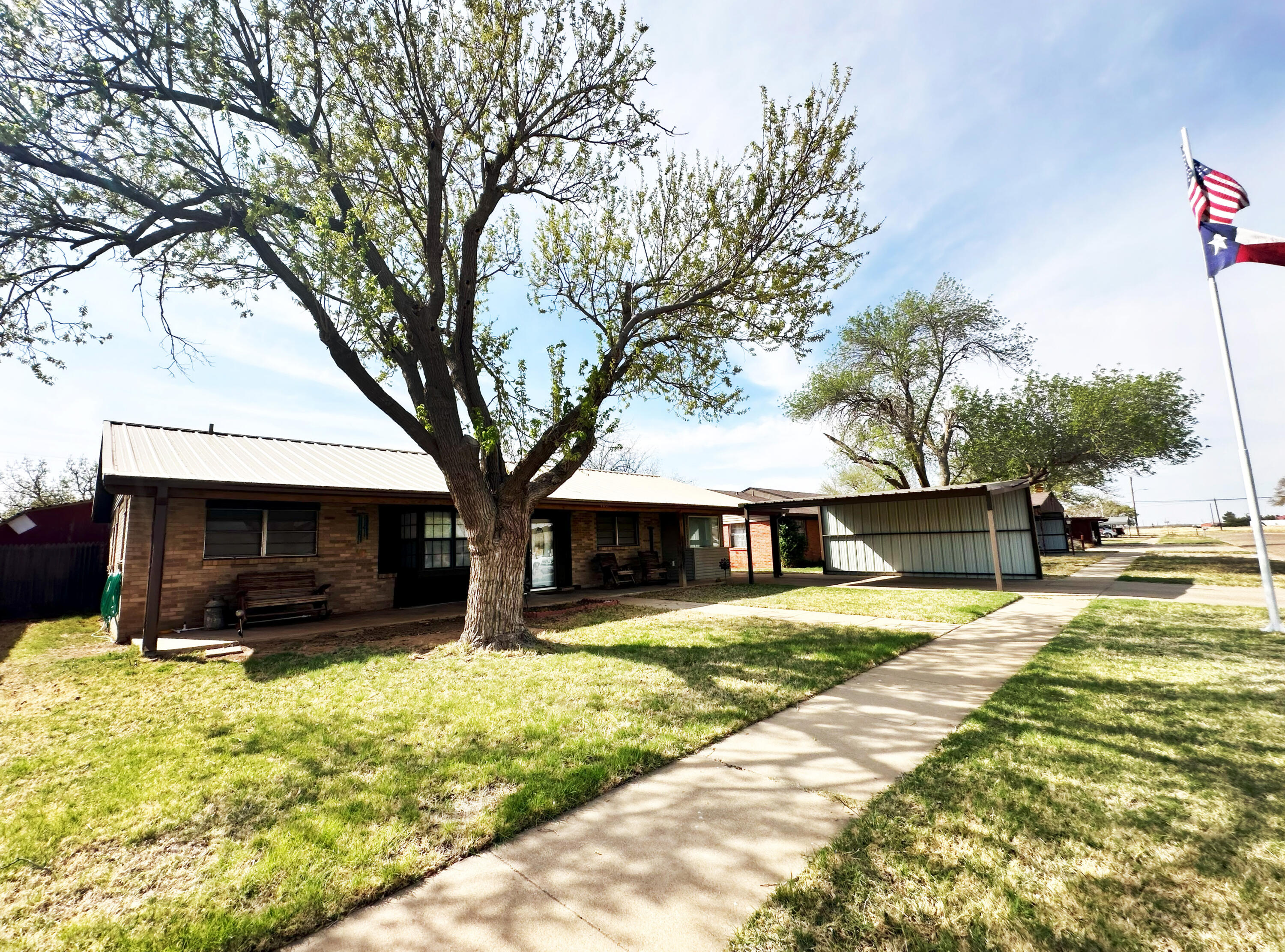 403 Osage Avenue Post, TX 79356 - Photo 31 of 31 a view of house with yard and trees in the background