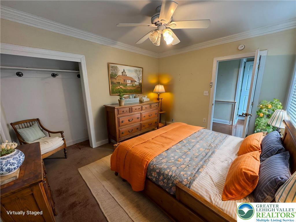 1352 Main Street Hellertown, PA 18055 - Photo 8 of 9 a bedroom with a bed and wooden floor