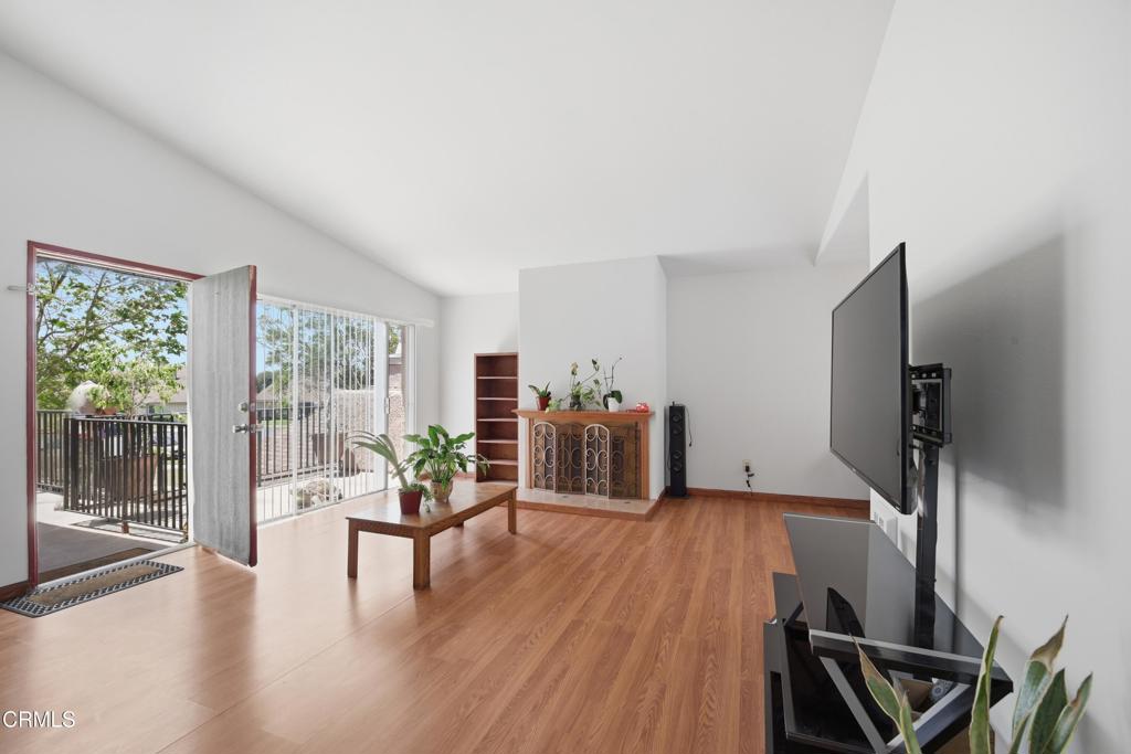 5154 Jefferson Square Oxnard, CA 93033 - Photo 7 of 23 a living room with furniture and a flat screen tv