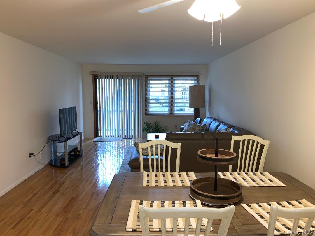 135 West Nyack Road, Unit 51 Nanuet, NY 10954 - Photo 2 of 16 Huge living room which opens to formal dining area and sliders to a trex deck overlooking trees