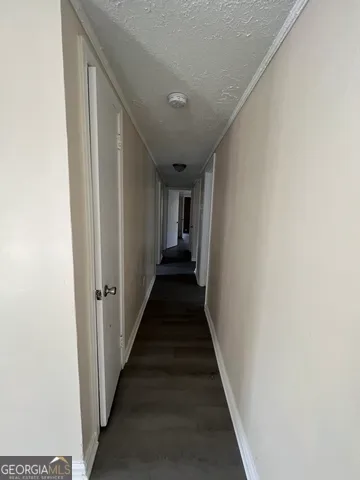 a view of a hallway with the wooden floor
