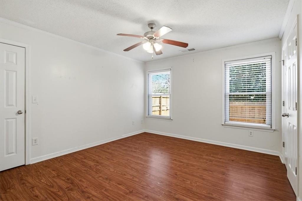 3018 Broadleaf Trail Road Fairburn, GA 30213 - Photo 11 of 26 wooden floor in an empty room with a window