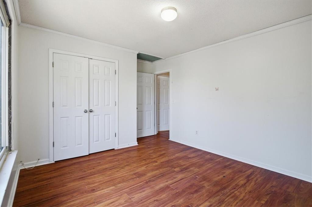3018 Broadleaf Trail Road Fairburn, GA 30213 - Photo 14 of 26 a view of an empty room with wooden floor