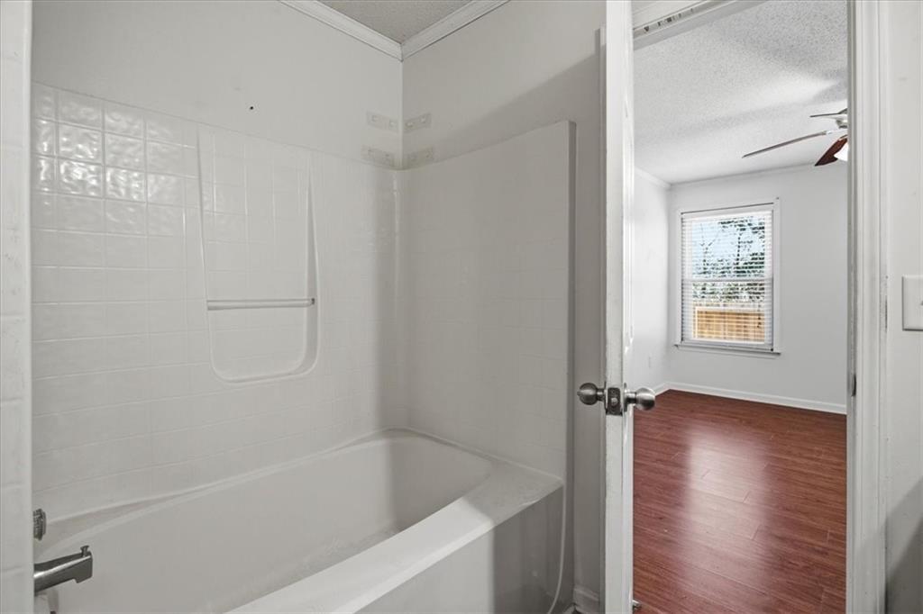3018 Broadleaf Trail Road Fairburn, GA 30213 - Photo 19 of 26 a white bath tub sitting next to a window