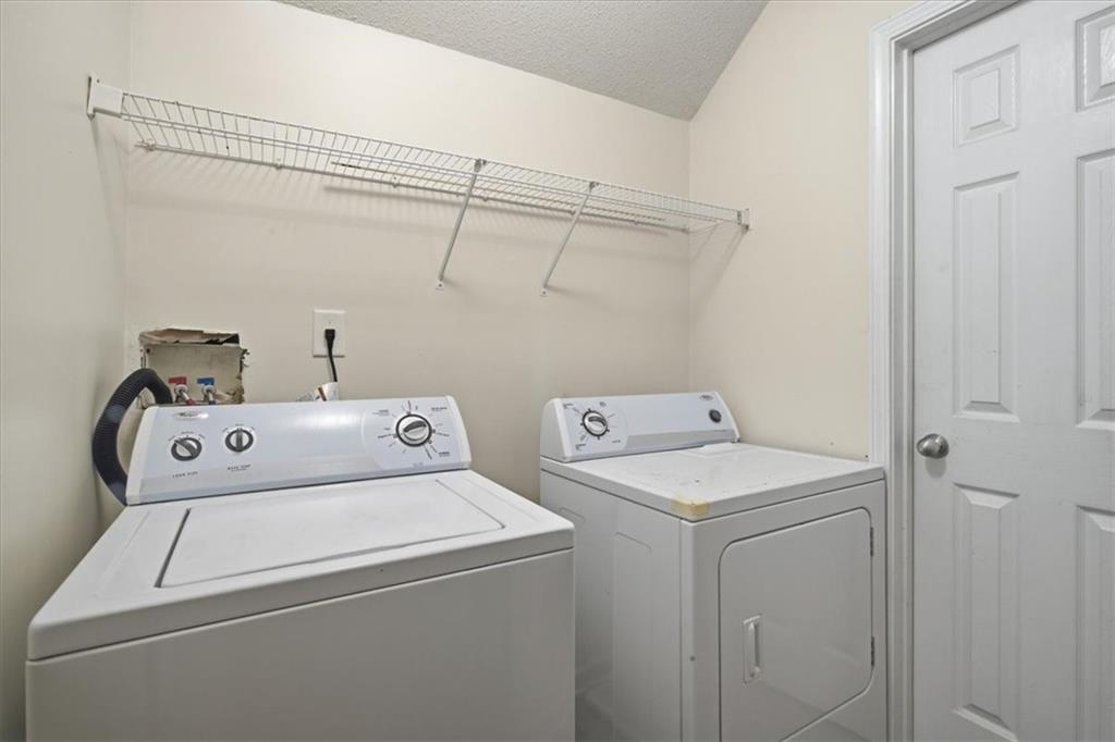 3018 Broadleaf Trail Road Fairburn, GA 30213 - Photo 20 of 26 a utility room with dryer and washer