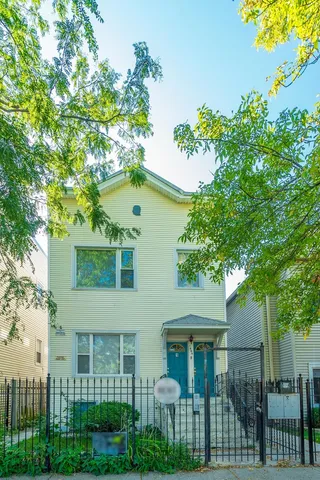 front view of a house with a garden
