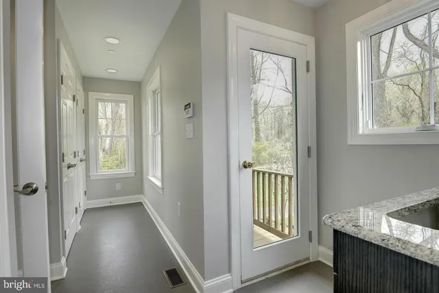 a view of a hallway with windows