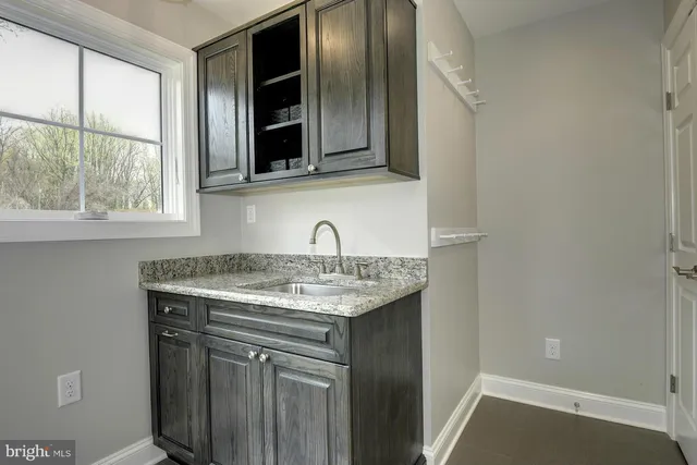 a kitchen with a sink and a window