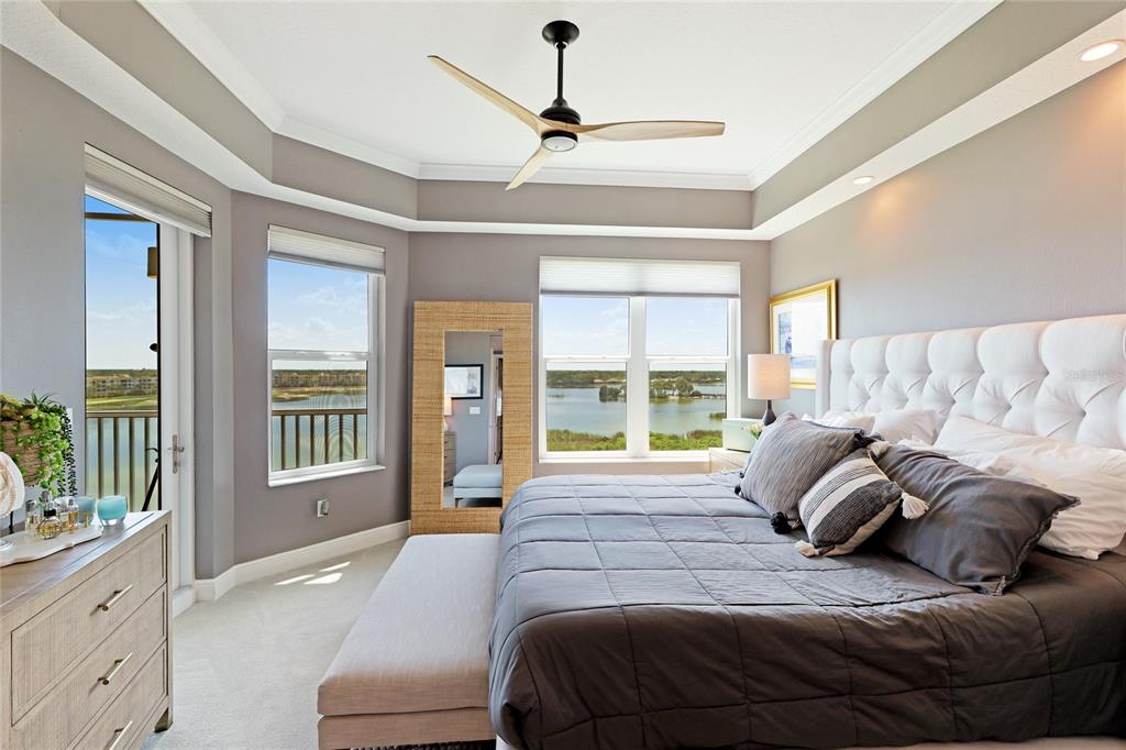 10520 Boardwalk Loop, Unit 704 Lakewood Ranch, FL 34202 - Photo 18 of 55 a bedroom with a large bed and a large window