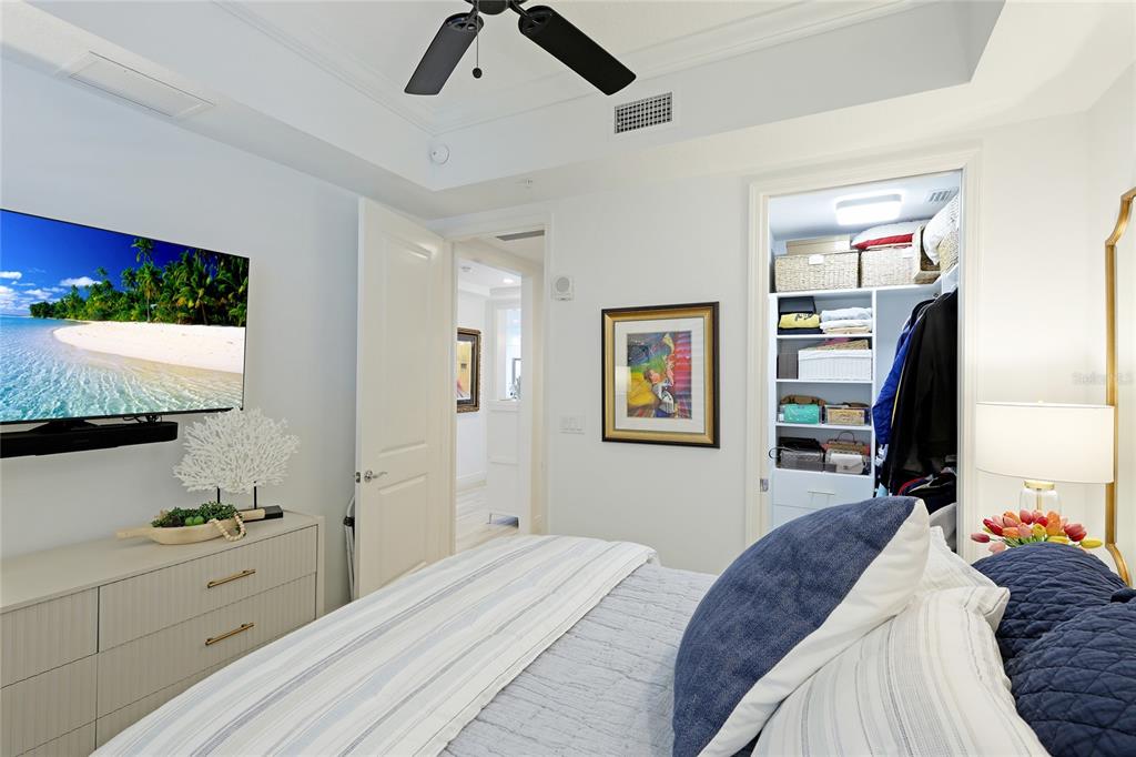 10520 Boardwalk Loop, Unit 704 Lakewood Ranch, FL 34202 - Photo 26 of 55 a bedroom with a bed and a flat screen tv