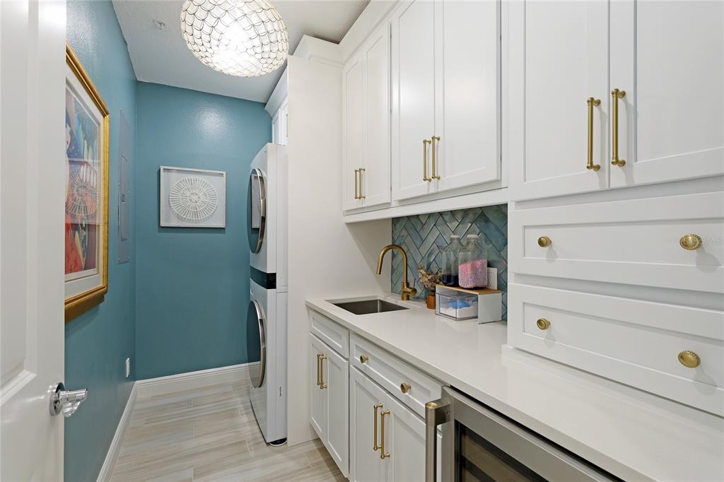10520 Boardwalk Loop, Unit 704 Lakewood Ranch, FL 34202 - Photo 29 of 55 a kitchen with stainless steel appliances white cabinets and a refrigerator