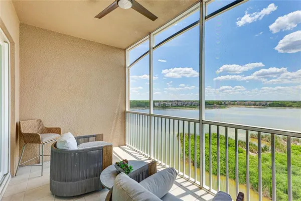 a view of a balcony with floor to ceiling window wooden floor