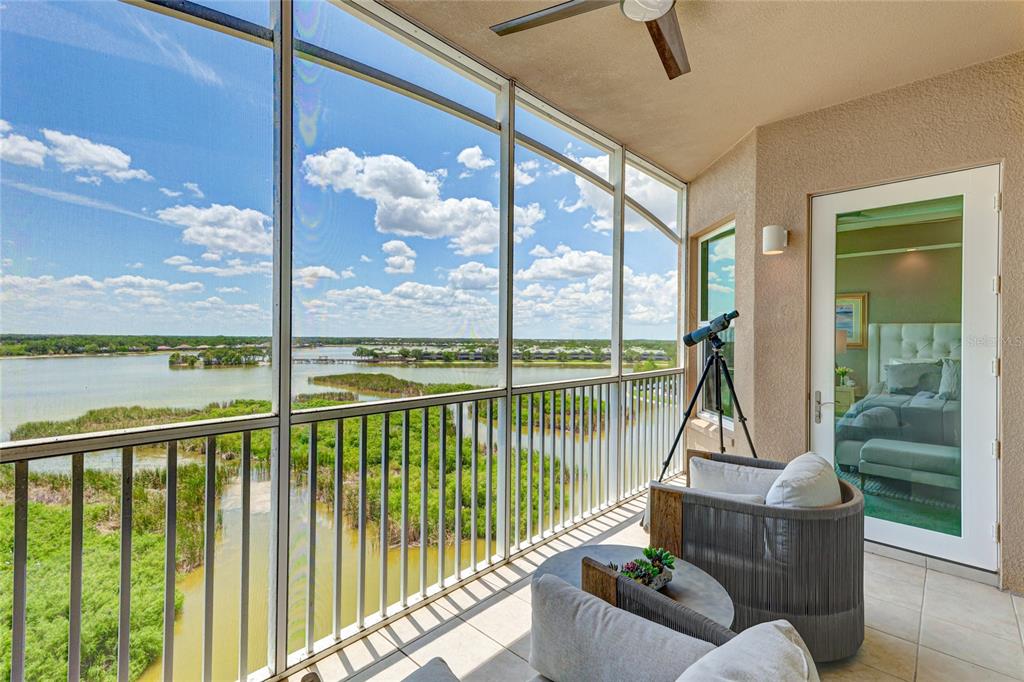 10520 Boardwalk Loop, Unit 704 Lakewood Ranch, FL 34202 - Photo 32 of 55 a view of a balcony with floor to ceiling window wooden floor