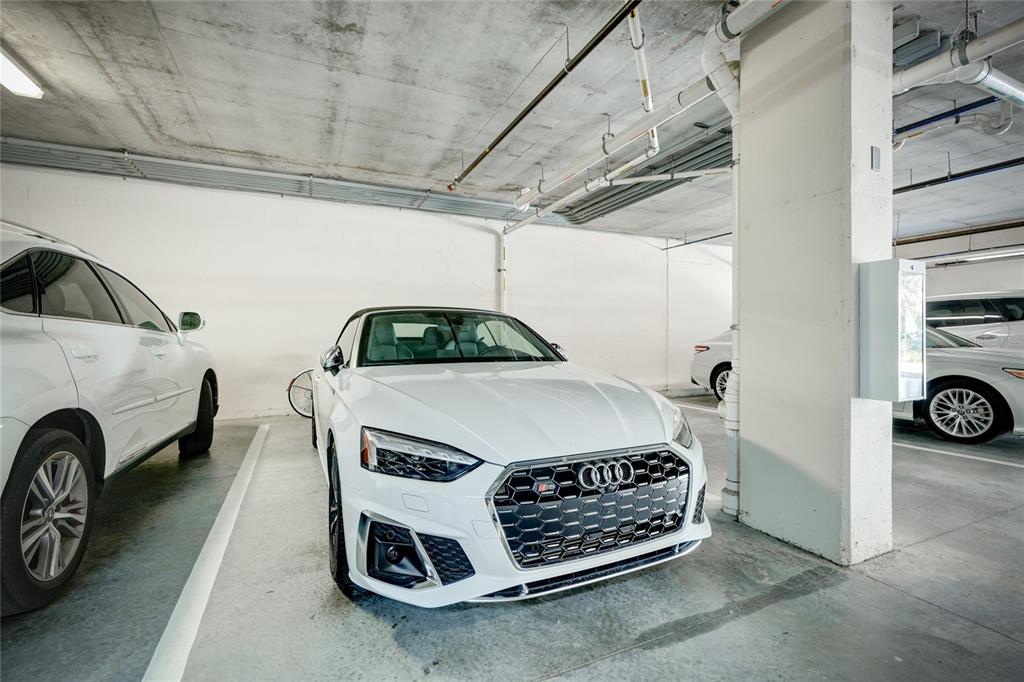 10520 Boardwalk Loop, Unit 704 Lakewood Ranch, FL 34202 - Photo 38 of 55 a car and bike parked in a garage