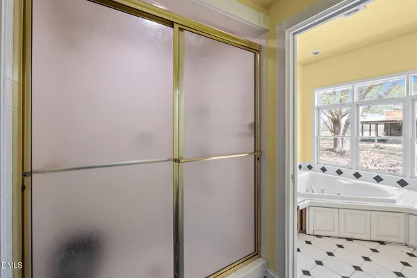 a bathroom with a bathtub and a shower
