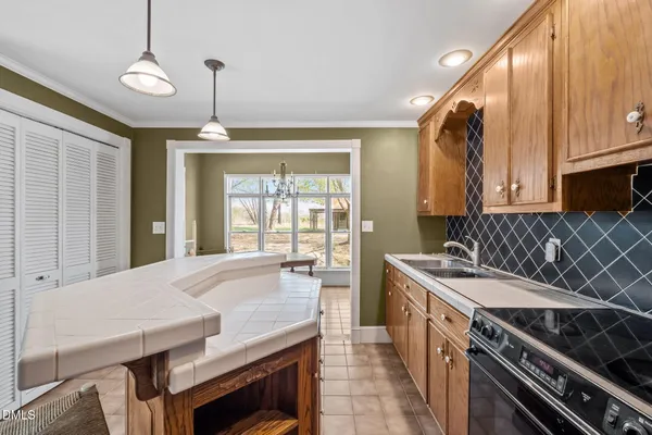 a kitchen with a stove and a sink