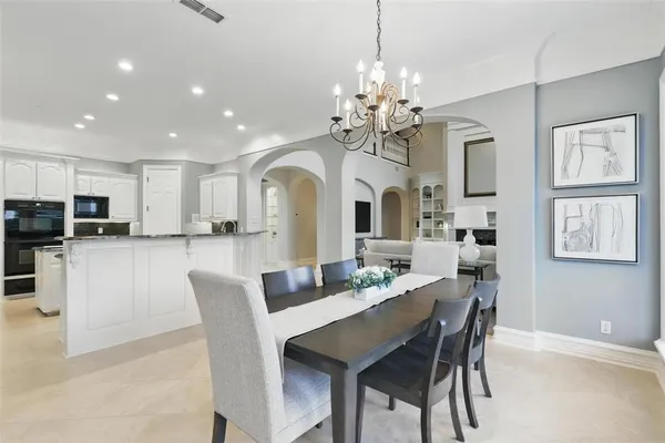 a kitchen with stainless steel appliances granite countertop a sink and cabinets