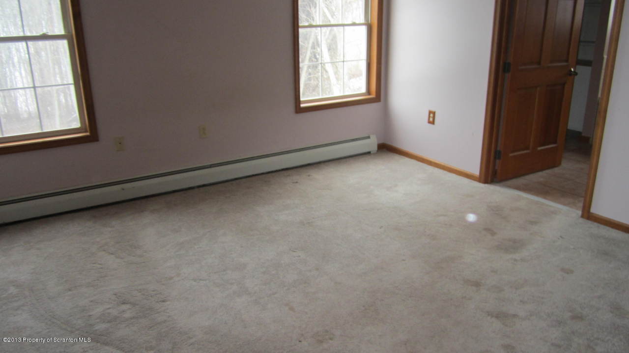 420 Municipal Road Dallas, PA 18612 - Photo 11 of 11 an empty room with windows