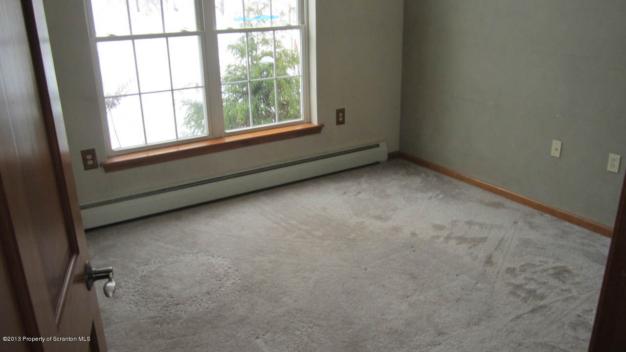 420 Municipal Road Dallas, PA 18612 - Photo 5 of 11 an empty room with a window