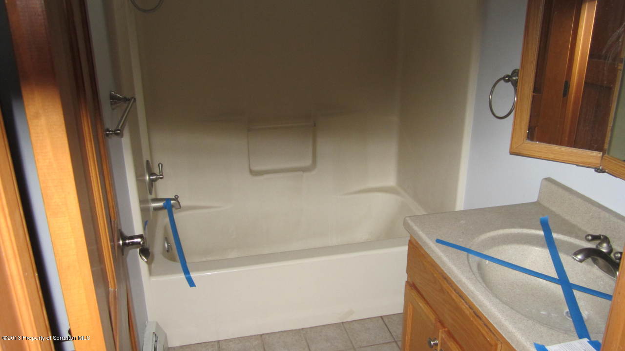 420 Municipal Road Dallas, PA 18612 - Photo 6 of 11 a bathroom with a bathtub and a sink