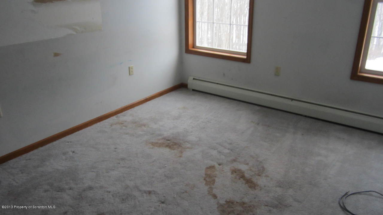 420 Municipal Road Dallas, PA 18612 - Photo 7 of 11 an empty room with windows