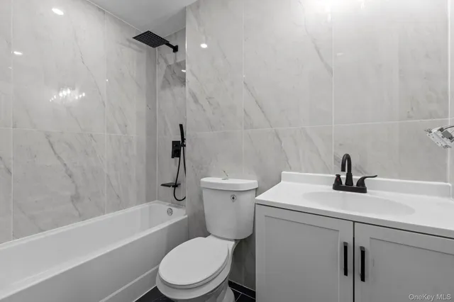 a bathroom with a sink a toilet and a bathtub