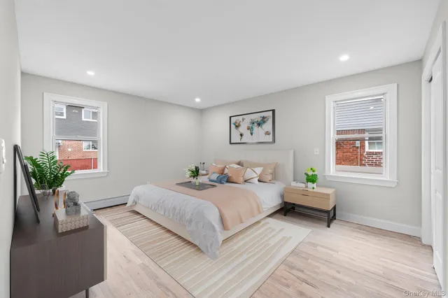 a bedroom with a bed and a couch