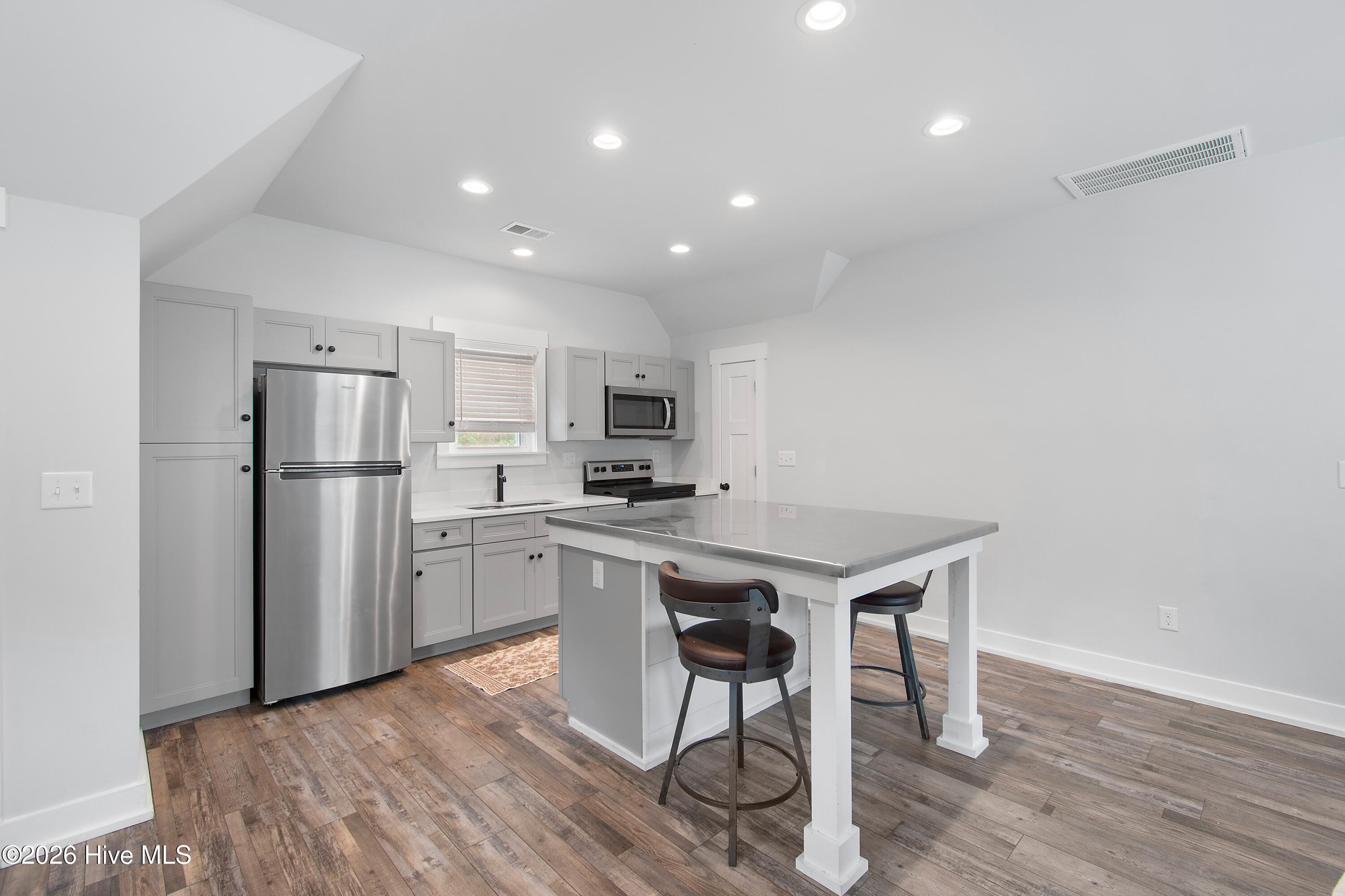417 Reaves Ferry Road Nakina, NC 28455 - Photo 9 of 42 Kitchen with SS appliances & Island