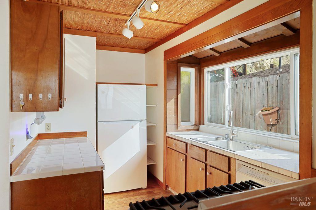 34 Sandy Beach Road Vallejo, CA 94590 - Photo 29 of 63 a bathroom with a sink and a large mirror