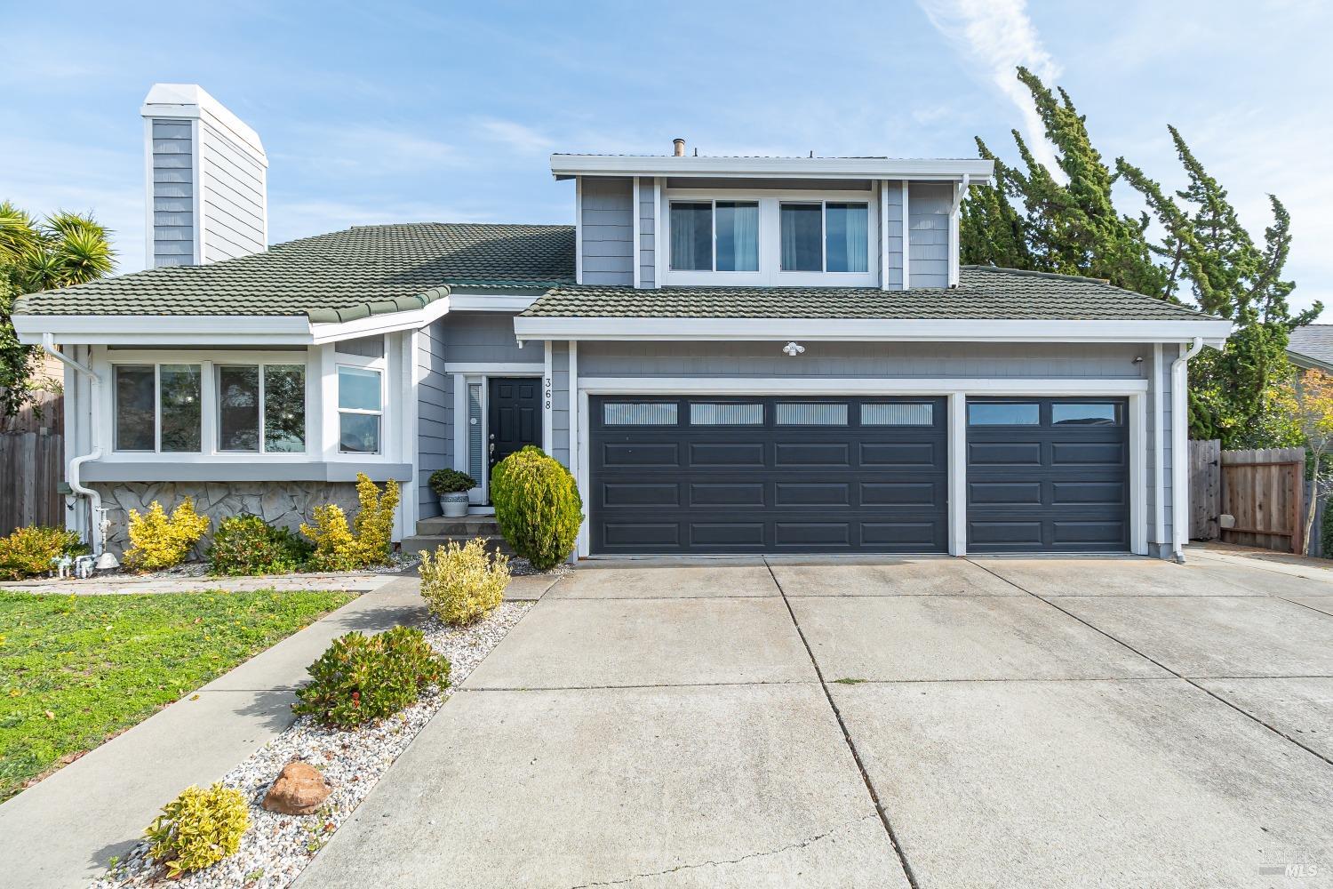 a house view with a garden space
