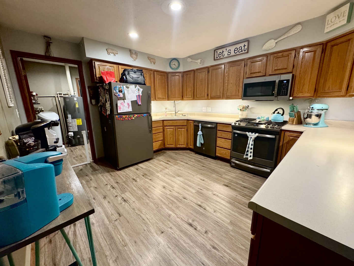 308 North Alexander Street Clinton, IL 61727 - Photo 7 of 20 a kitchen with stainless steel appliances granite countertop a refrigerator a stove top oven a sink and dishwasher