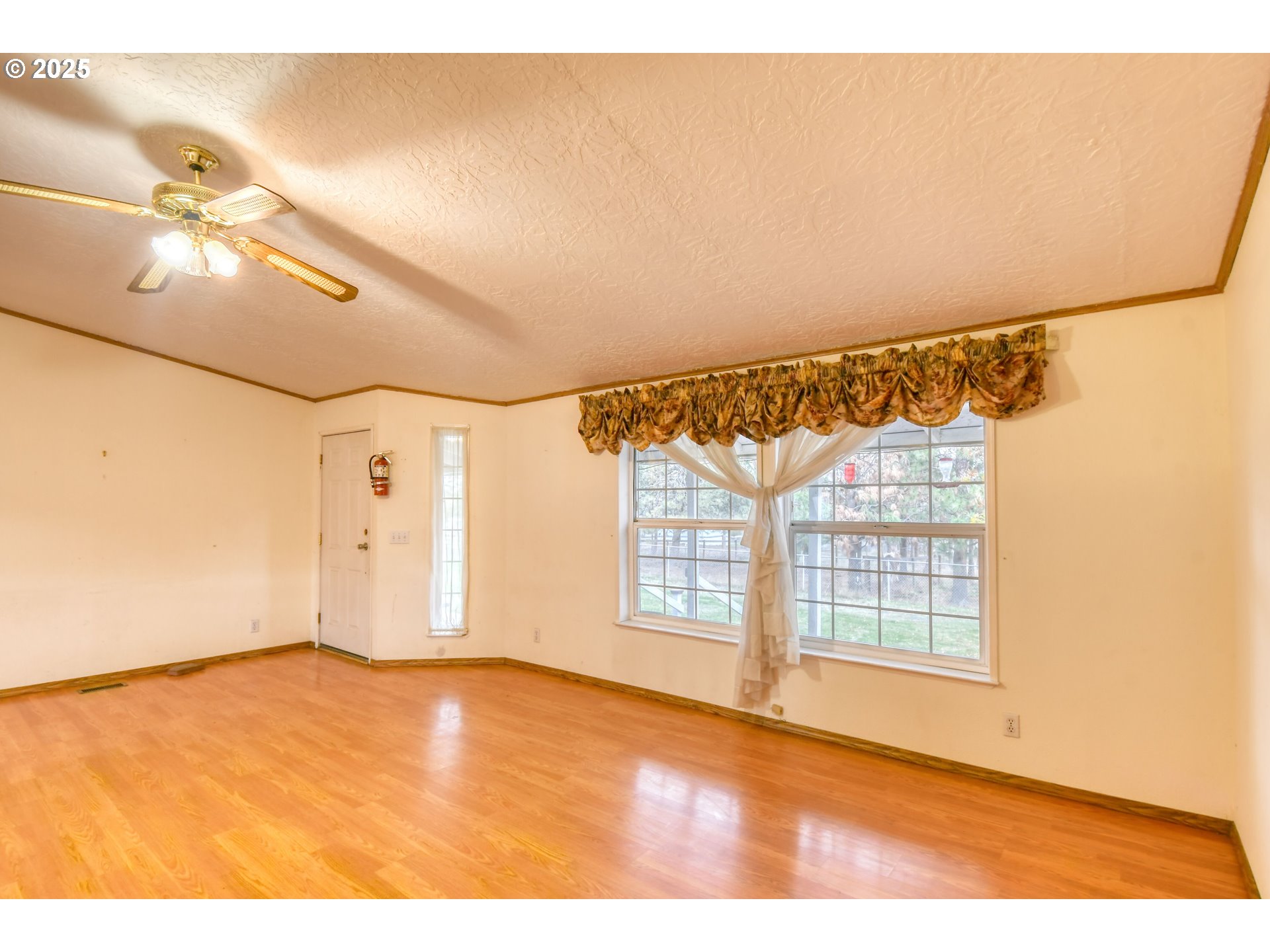 73306 Southeast 54th Street Pendleton, OR 97801 - Photo 3 of 39 a view of an empty room with a window