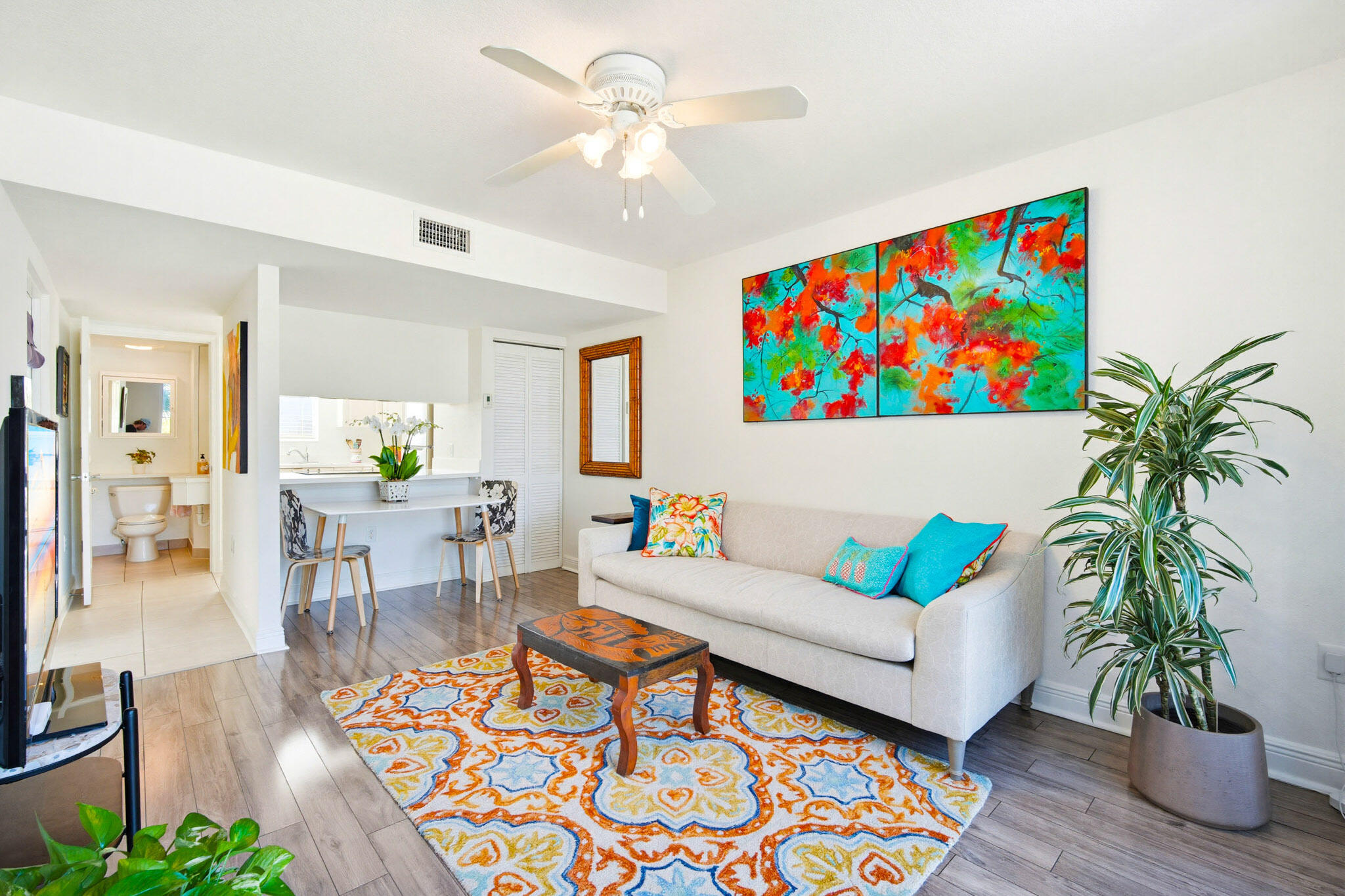 63 Seaside N Court Key West, FL 33040 - Photo 17 of 40 a living room with furniture potted plant and a table
